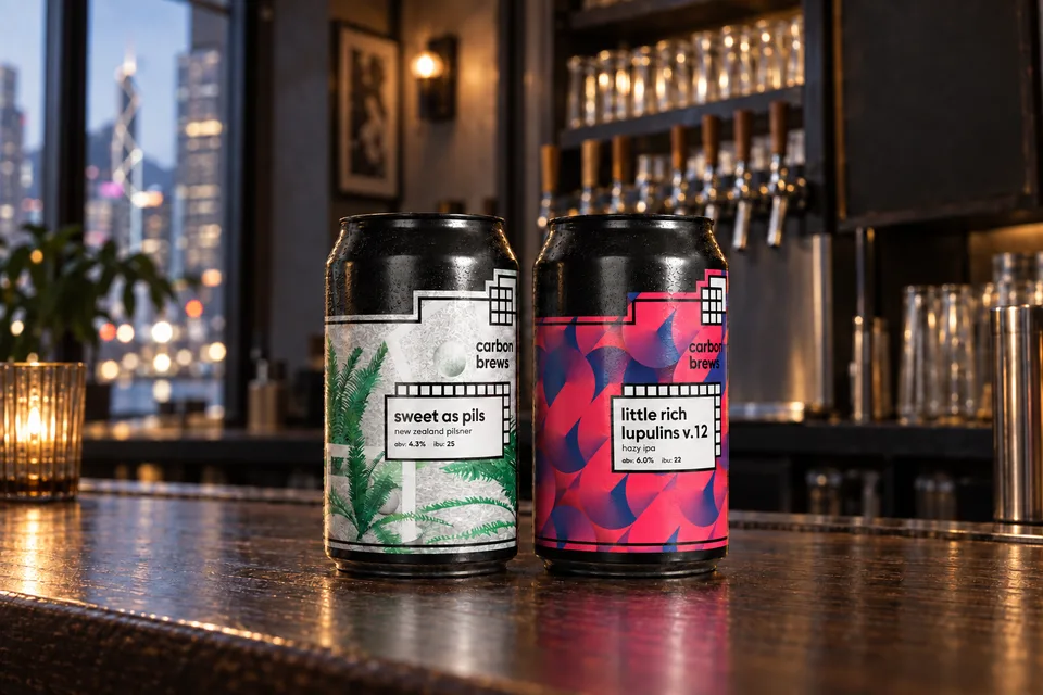 Carbon Brews beer pair photographed on a compact Central bar counter