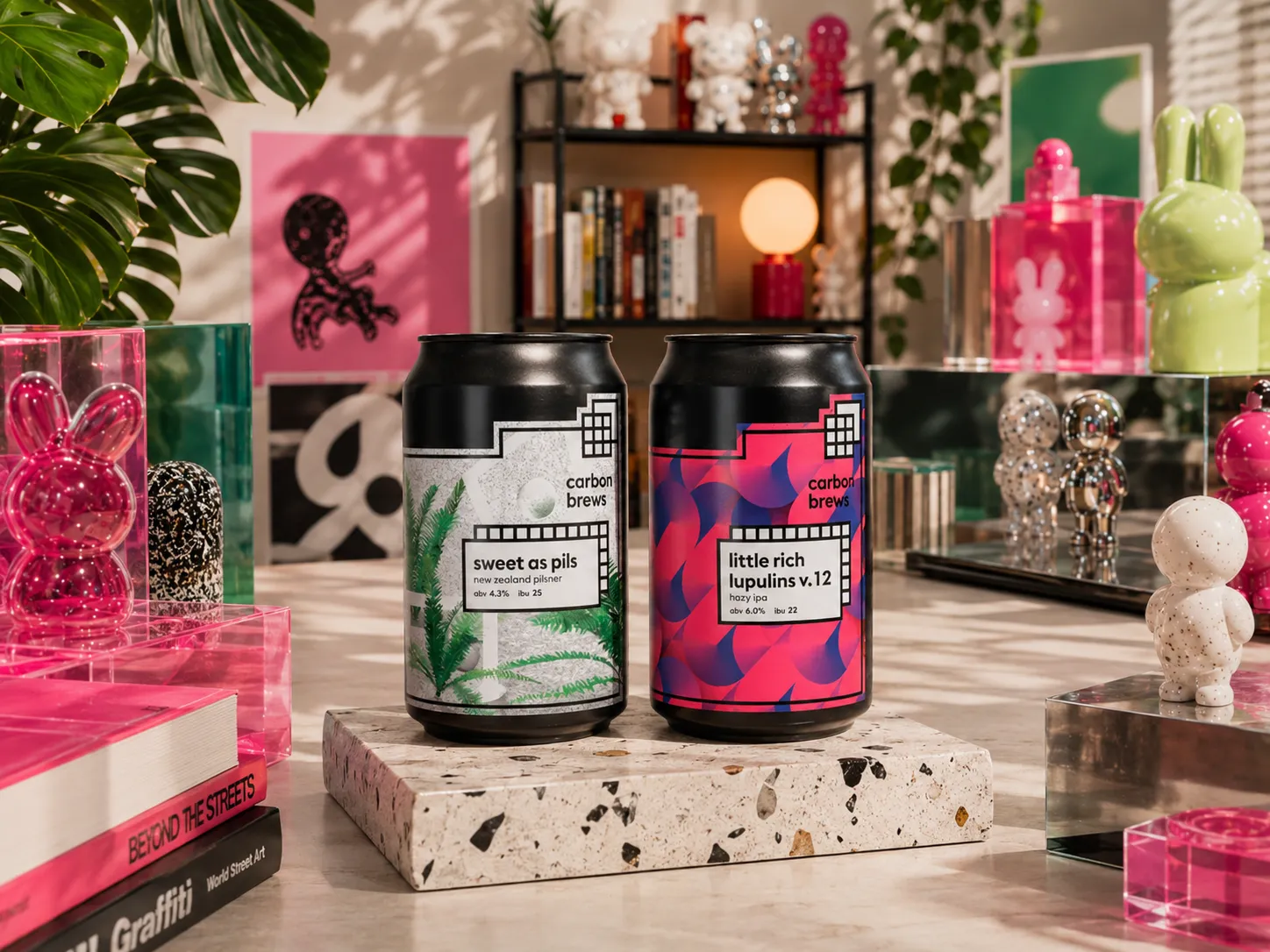Carbon Brews Sweet As Pils and Little Rich Lupulins v.12 cans shown together on a terrazzo plinth
