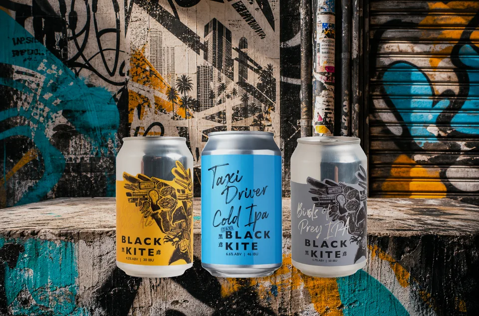 Black Kite can trio in a Hong Kong night street