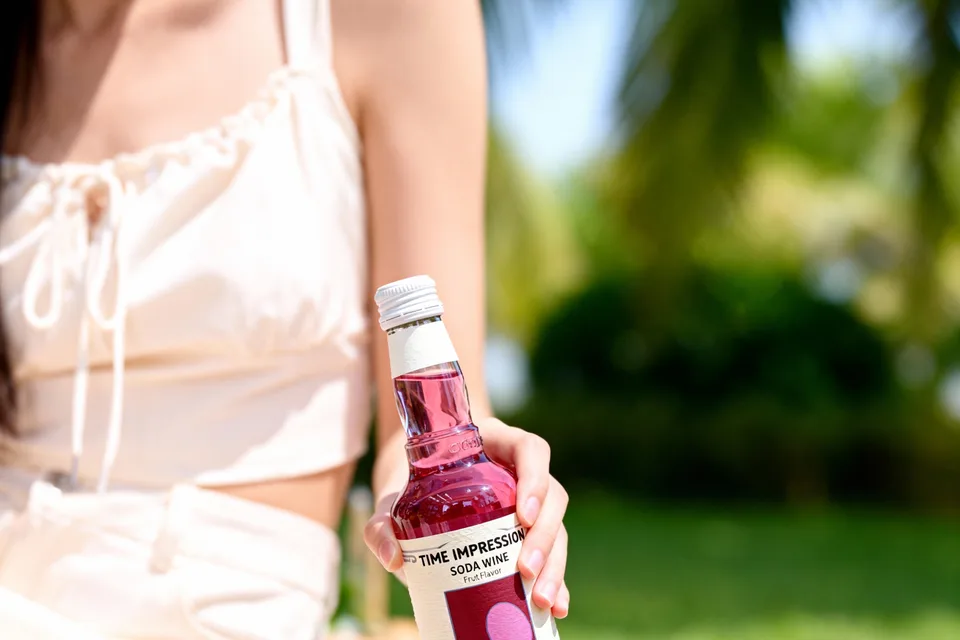 Time Impression bottle in a picnic scene