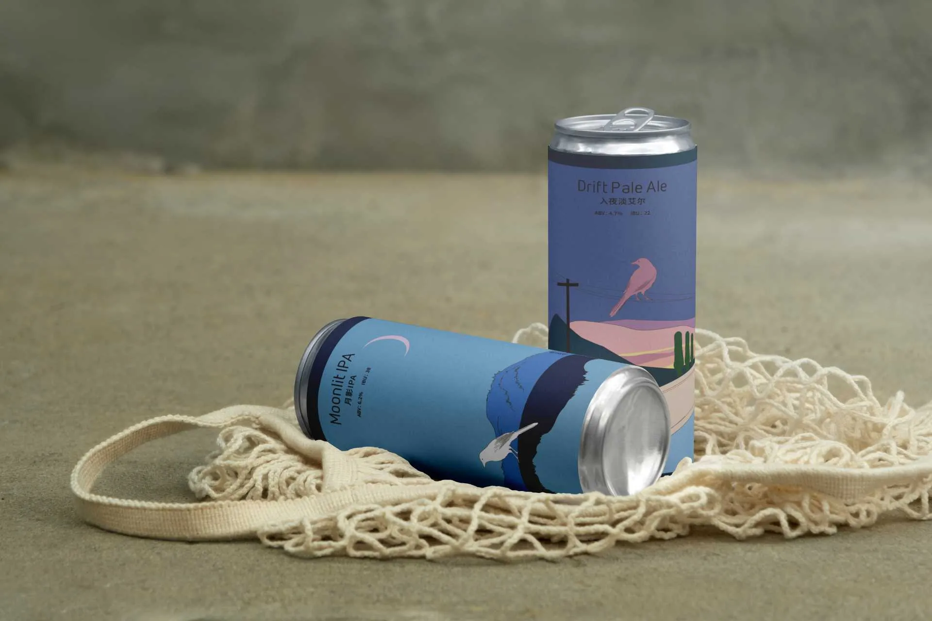 Moonlit IPA and Drift Pale Ale cans arranged on a woven bag in soft natural light