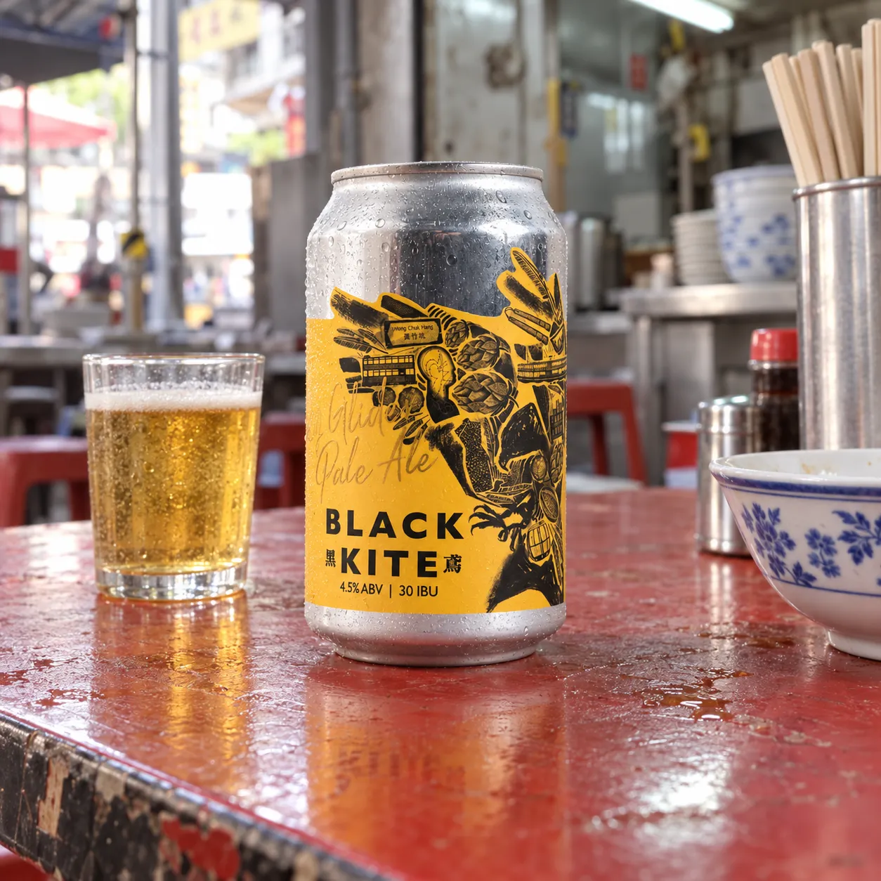 Black Kite Easy Glider Pale Ale on a worn red table at a Hong Kong dai pai dong