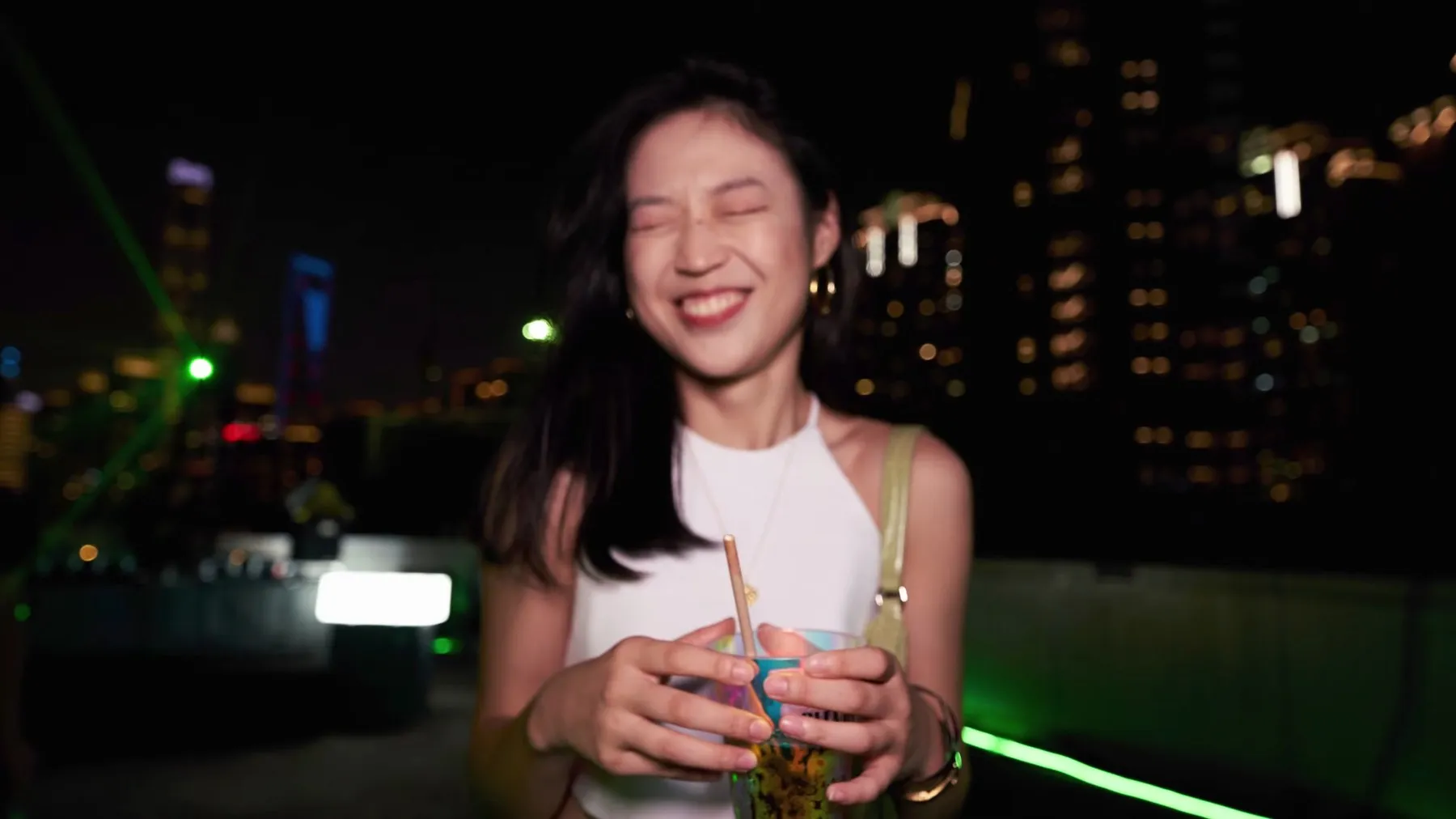 Guest holding a drink at the Hennessy New Point party