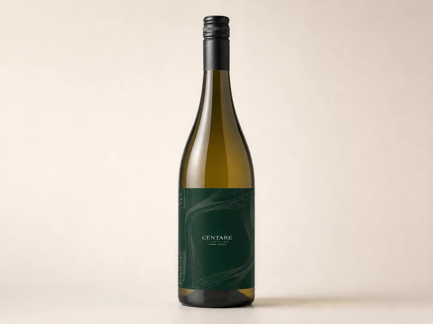 CENTARE Chardonnay bottle on a pale neutral background showing the deep green linear label