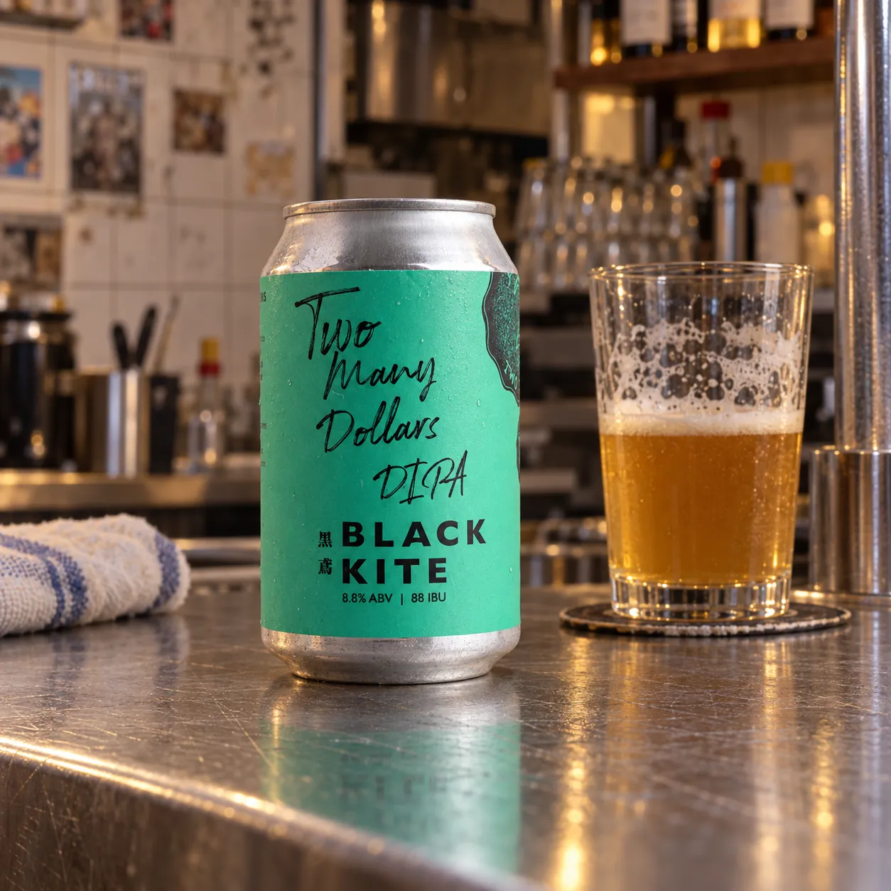 Black Kite Two Many Dollars DIPA standing on a scratched counter in a lived-in Hong Kong neighbourhood bar
